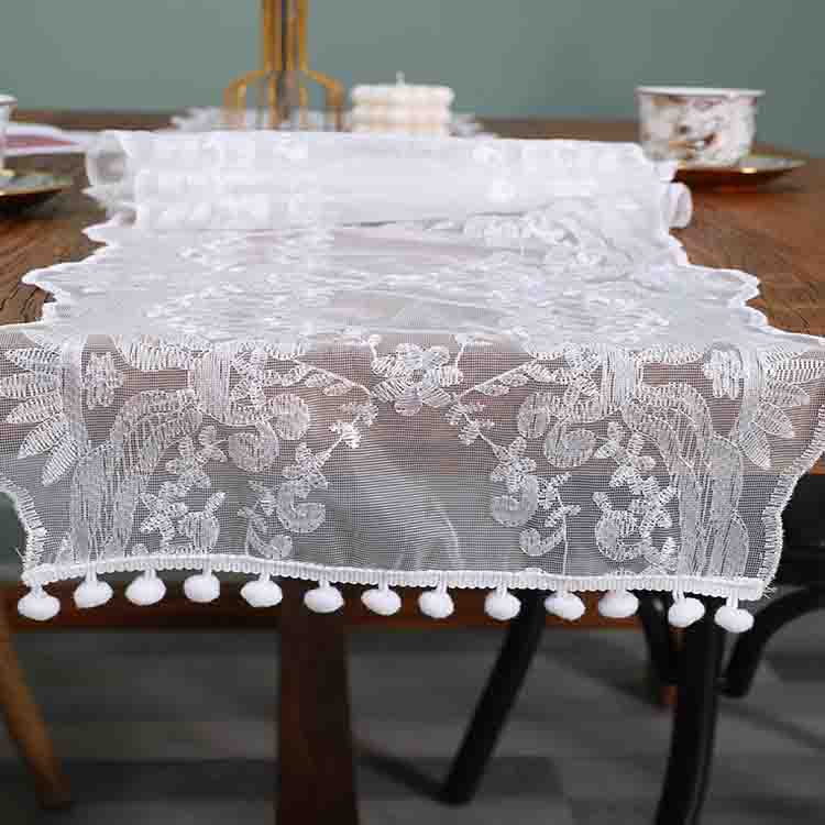 white table runner with tassels