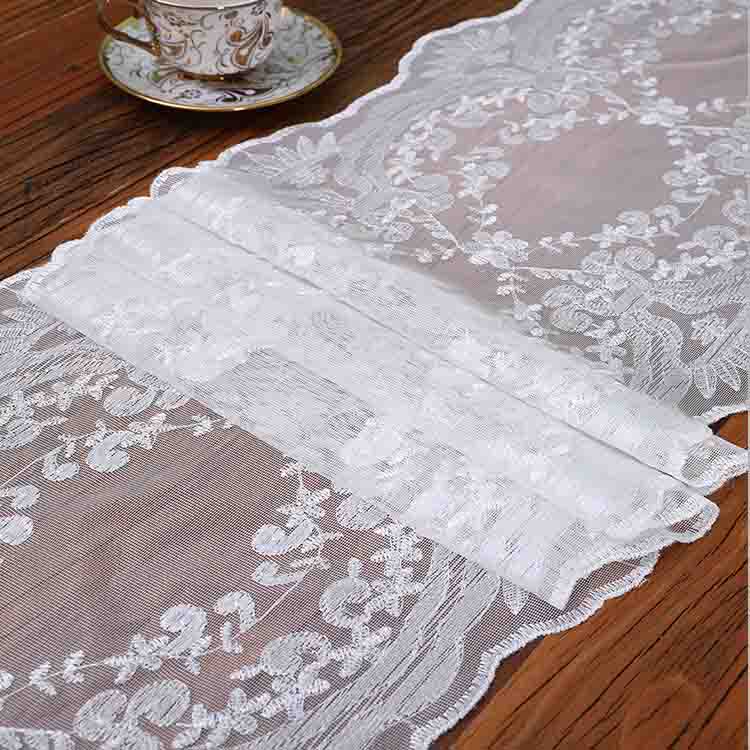 white table runner with tassels